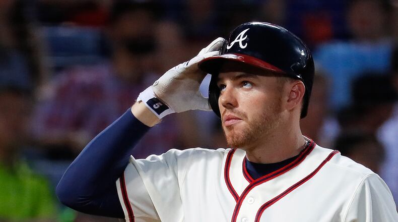 ATLANTA, GA - JUNE 25: Freddie Freeman #5 of the Atlanta Braves reacts after swinging through a pitch in the sixth inning against the New York Mets at Turner Field on June 25, 2016 in Atlanta, Georgia. (Photo by Kevin C. Cox/Getty Images)