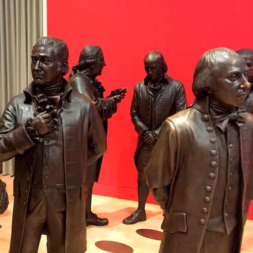 FILE - Life-size bronze sculptures of the signers of the U.S. Constitution stand in the Signers' Hall on July 7, 2016, at the National Constitution Center in Philadelphia. (AP Photo/Beth J. Harpaz, File)