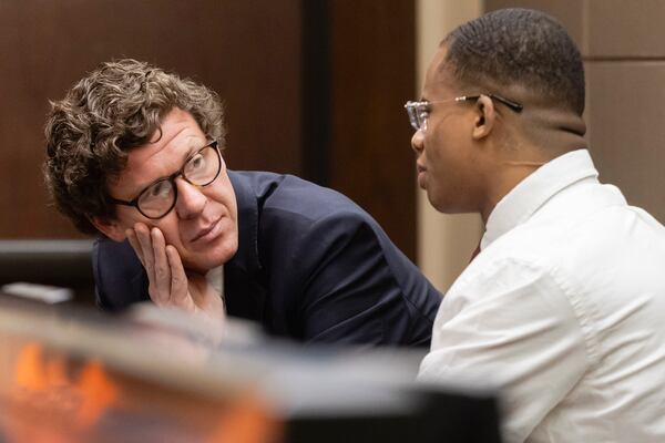 Defense attorney John Hunter confers with defendant Taymor McIntyre as they wait for a verdict on the second day of jury deliberations in trial of McIntyre in San Antonio, on Monday, April 14, 2025. (Josie Norris/The San Antonio Express-News via AP)