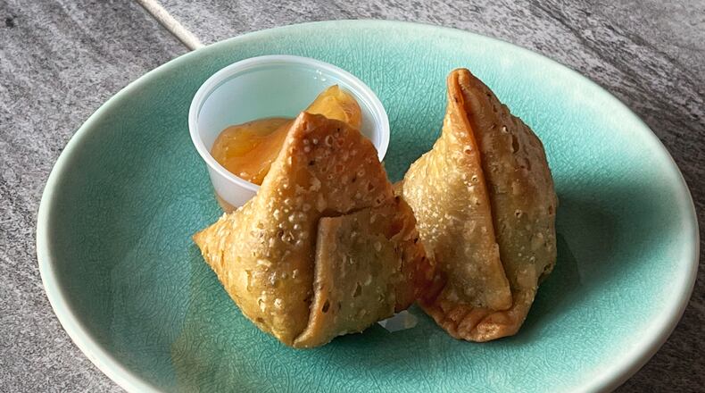 The duck samosas from Tabla deliver exciting flavor, while retaining all the characteristics you love most about the Indian dish. Henri Hollis/henri.hollis@ajc.com