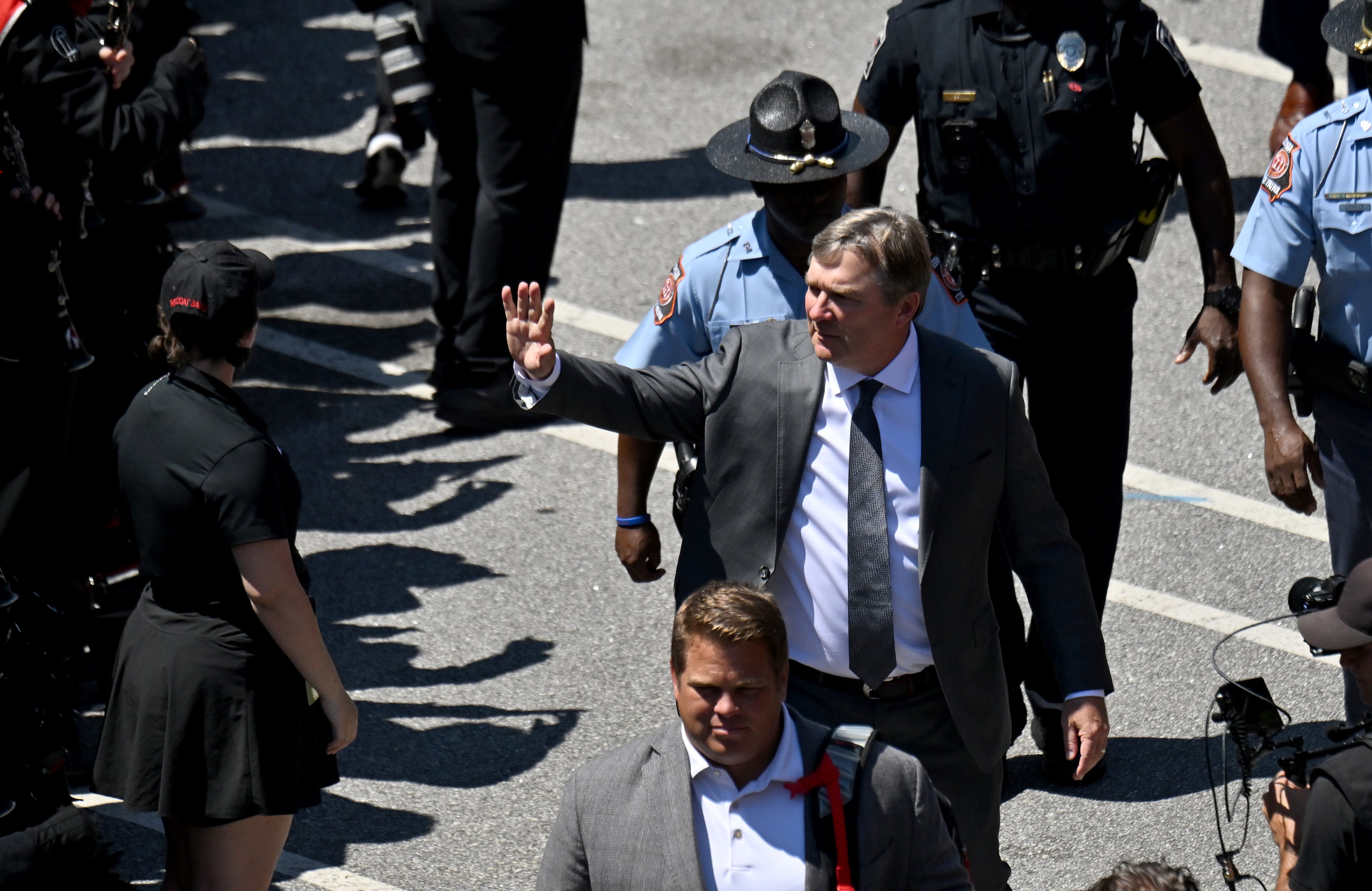 Georgia head coach Kirby Smart waves as players and staff arrive during Dawgs Walk before Georgia football's season opener and home opener against Marshall at Sanford Stadium, Saturday, August 30, 2025, in Athens. (Hyosub Shin / AJC)