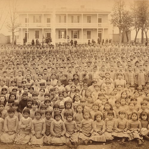 This photo provided by the Carlisle Indian School Digital Resource Center shows the Carlisle Indian Industrial School student body in front of the superintendent's house in Carlisle, Pa., circa 1885. (John N. Choate/Carlisle Indian School Digital Resource Center via AP)