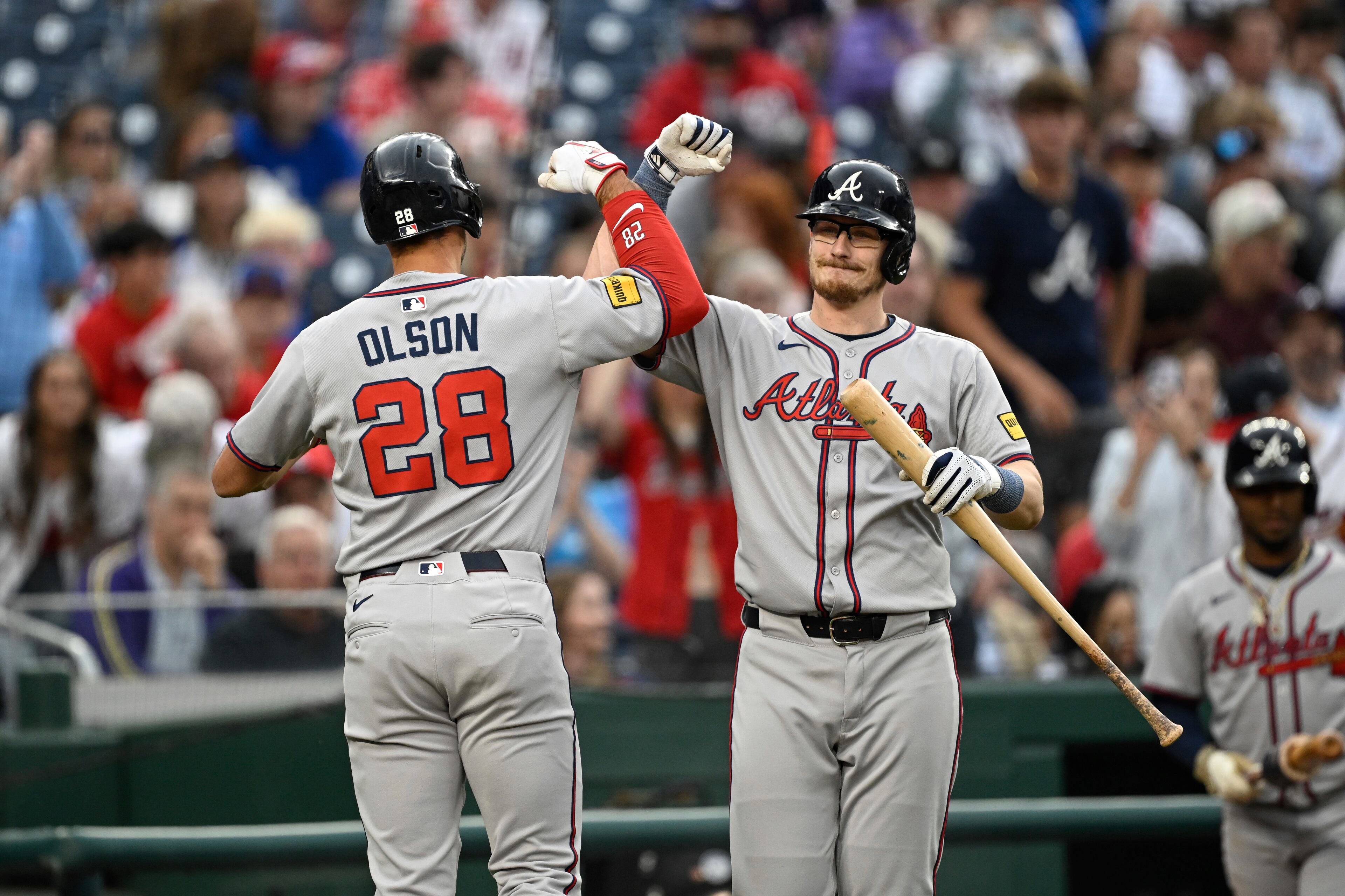 Atlanta Braves' Matt Olson (28) is greeted by Sean Murphy after hitting a solo home run against Washington Nationals pitcher Mitchell Parker during the first inning of a baseball game in Washington, Tuesday, May 20, 2025. (AP Photo/Terrance Williams)