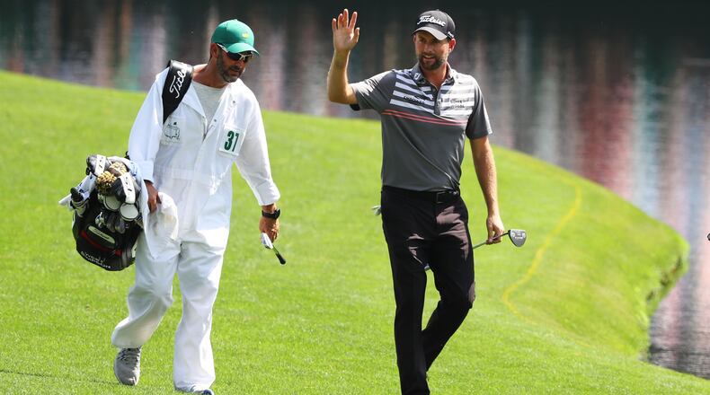 Webb Simpson waves to the gallery as he walks to the green on No. 16  during the third round of the Masters Tournament Saturday, April 13, 2019, at Augusta National Golf Club in Augusta. Curtis Compton / ccompton@ajc.com