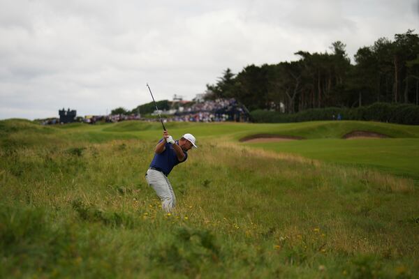 Bryson DeChambeau of the United States plays out of the rough on the 3rd hole during the first round of the British Open golf championship at the Royal Portrush Golf Club, Northern Ireland, Thursday, July 17, 2025. (AP Photo/Francisco Seco)