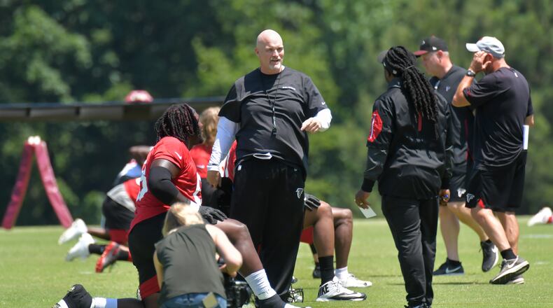 Falcons head coach Dan Quinn goes to work with his guys during some off-season training at Flowery Branch. (HYOSUB SHIN / HSHIN@AJC.COM)