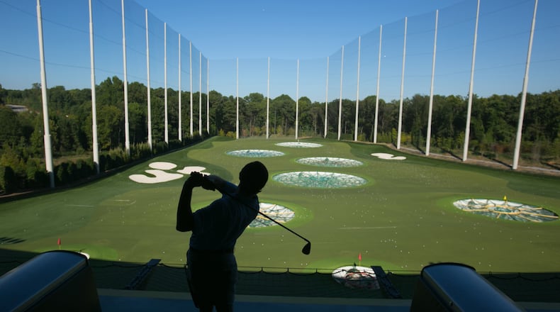 An instructor at Topgolf Alpharetta shows how the game is played.