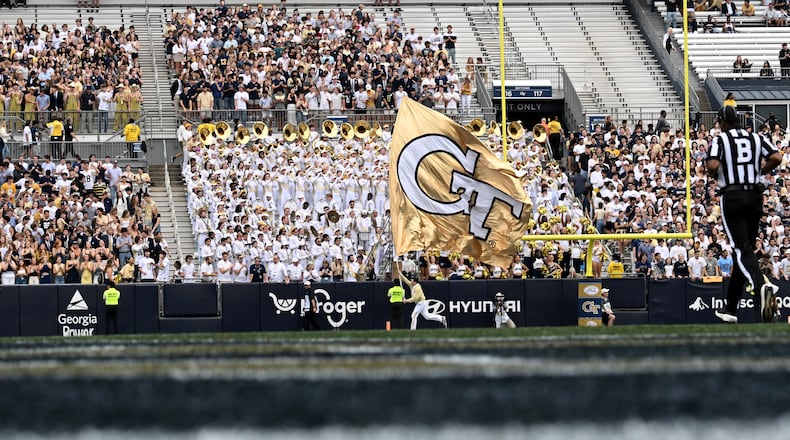 Fans react after scoring a touchdown during the first half of an NCAA college football game at Georgia Tech's Bobby Dodd Stadium, Saturday, Nov. 9, 2024, in Atlanta. Georgia Tech won 28-23 over Miami. (Photo by Hyosub Shin / The Atlanta Journal-Constitution)