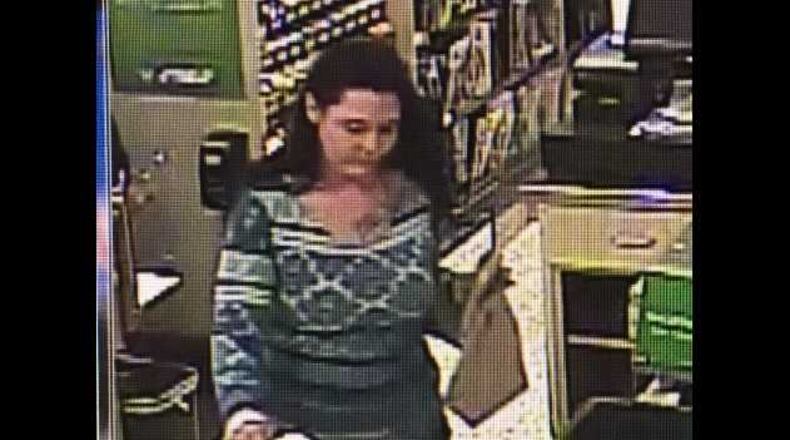 Police in Roswell are looking for this woman who they say stole a wallet and used the credit cards inside to buy gift cards and items at local stores.