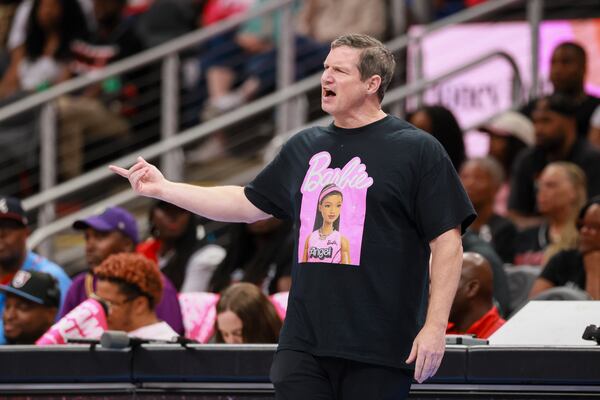 Atlanta Dream head coach Karl Smesko honors Angel Reese via T-shirt during the team’s recent Barbie Night. (Jason Getz/AJC)