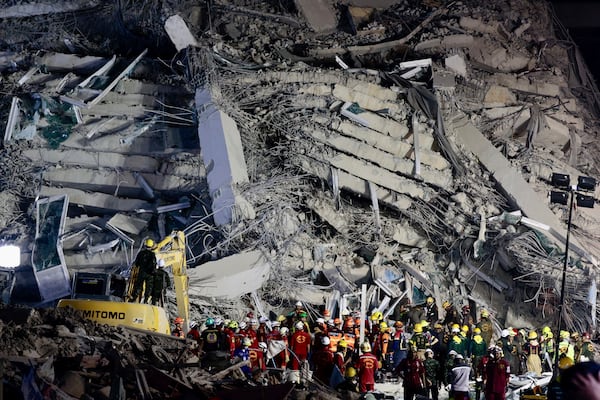 Rescuers work at the site a high-rise building under construction that collapsed after a 7.7 magnitude earthquake in Bangkok, Thailand, early Saturday, March 29, 2025. (AP Photo/Wason Wanichakorn)