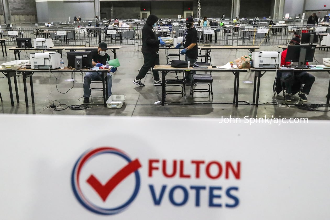 Fulton County elections workers open and sort ballots at the Georgia World Congress Center in Atlanta on Jan. 5, 2021. (AJC file photo)