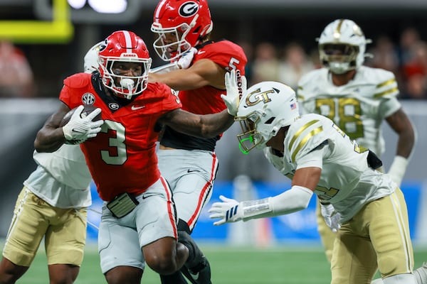 Georgia running back Nate Frazier (3) ran for a 22-yard gain against Georgia Tech at Mercedes-Benz Stadium in Atlanta on Friday. (Jason Getz/AJC)