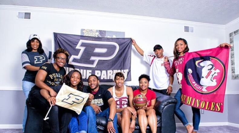 Photo of the Morgan-Gray family and their respective college affiliations. (Photo courtesy of Angel Gray)