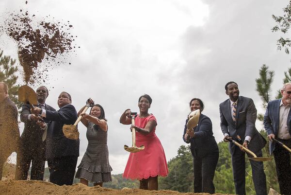 Atlanta Mayor Keisha Lance-Bottoms (center), Atlanta Parks and Recreation commissioner Amy Phuong (third from left) and Atlanta Department of Watershed Management Commissioner Kishia Powell (third from right) are joined by members of the Atlanta City Council, Atlanta Beltline Inc. and the Atlanta Beltline Partnership as they break ground for the new Westside Park at the Bellwood Quarry in Atlanta, Thursday, September 6, 2018. The park, planned for years as both a recreational center and reservoir for drinking water, has been seen as a potential catalyst for redevelopment of the city’s northwest side. (ALYSSA POINTER/ALYSSA.POINTER@AJC.COM)