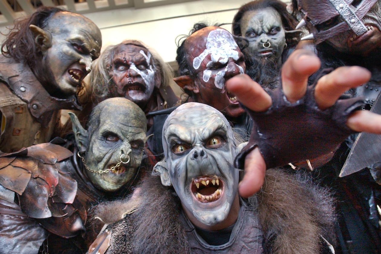 Orcs and Uruk-Hai characters from the "Lord of the Rings" movies could be found wandering the halls on the opening day of Dragon Con, the sci-fi convention held at the Hyatt Regency, on Aug. 29, 2003. This group consisted of costumers, actors, and make-up artists from Orlando and New York. Front and center is Brian Wolfe, who works in the Universal Studios prosthetics department. (Rich Addicks/AJC)