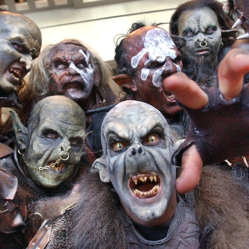 Orcs and Uruk-Hai characters from the "Lord of the Rings" movies could be found wandering the halls on the opening day of Dragon Con, the sci-fi convention held at the Hyatt Regency, on Aug. 29, 2003. This group consisted of costumers, actors, and make-up artists from Orlando and New York. Front and center is Brian Wolfe, who works in the Universal Studios prosthetics department. (Rich Addicks/AJC)