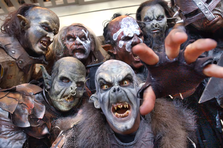 Orcs and Uruk-Hai characters from the "Lord of the Rings" movies could be found wandering the halls on the opening day of Dragon Con, the sci-fi convention held at the Hyatt Regency, on Aug. 29, 2003. This group consisted of costumers, actors, and make-up artists from Orlando and New York. Front and center is Brian Wolfe, who works in the Universal Studios prosthetics department. (Rich Addicks/AJC)