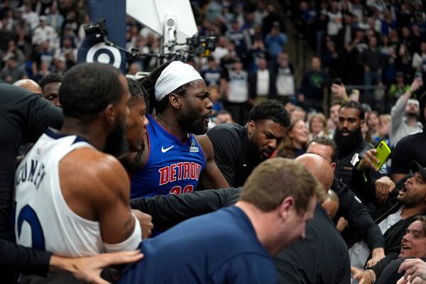 Minnesota Timberwolves and Detroit Pistons players get into a fight during the first half of an NBA basketball game, Sunday, March 30, 2025, in Minneapolis. (AP Photo/Abbie Parr)
