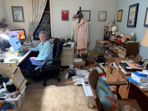 Former Atlanta Journal-Constitution obit writer Kay Powell in her home office. (Bill Torpy/AJC)