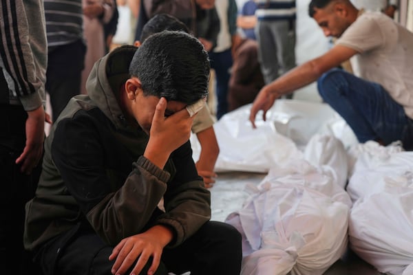 Palestinians mourn their relatives who were killed in an Israeli army airstrike on the Gaza Strip, at the Al-Aqsa Hospital in Deir al-Balah, Gaza, Wednesday, May 28, 2025. (AP Photo/Abdel Kareem Hana)