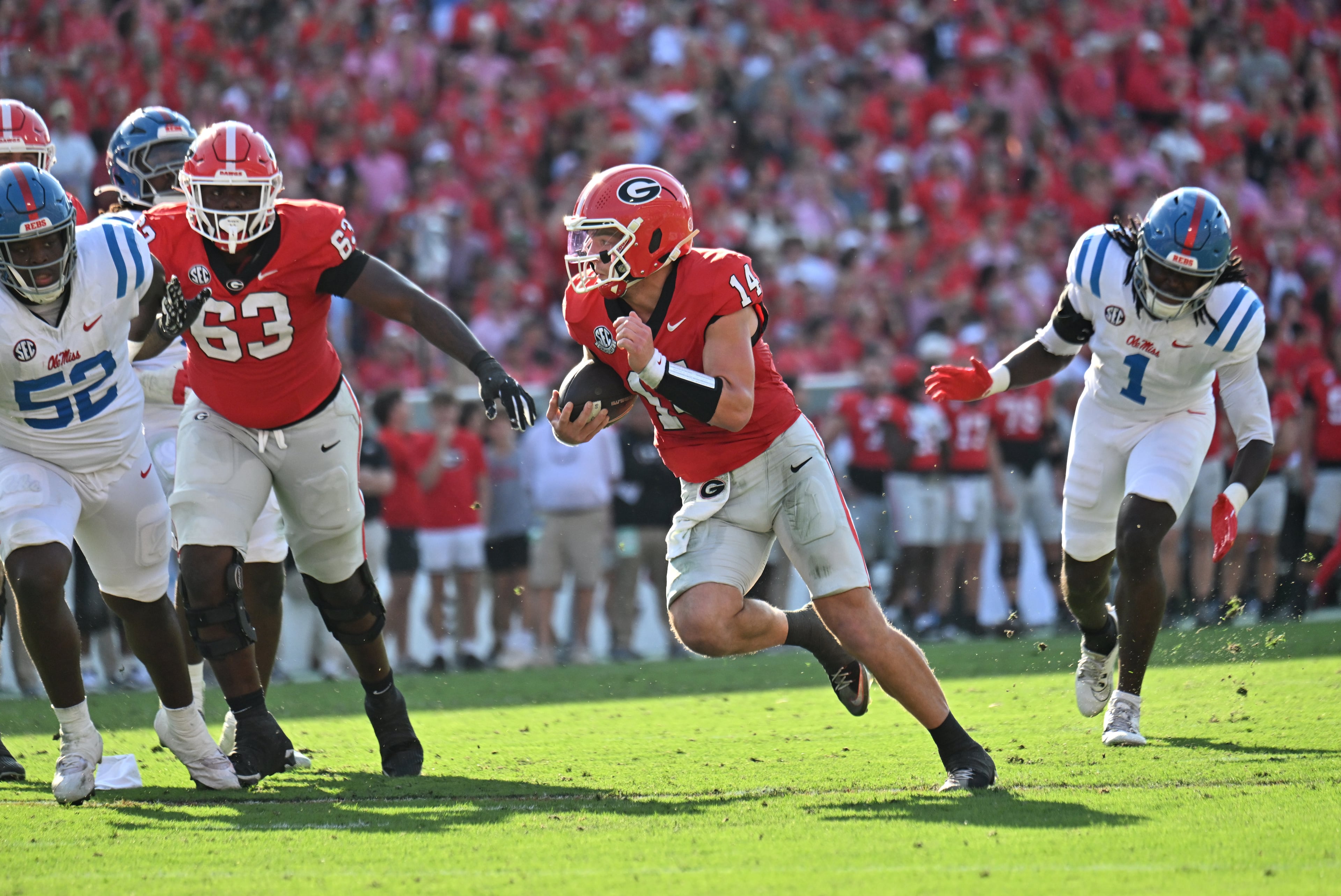 Georgia quarterback Gunner Stockton (14) runs for a touchdown catch during the first half in an NCAA football game at Sanford Stadium, Saturday, October 18, 2025, in Athens. (Hyosub Shin / AJC)