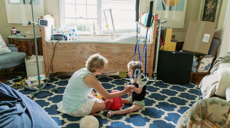 Mary Reed, pictured with her medically fragile daughter, is a board member of Atlanta Life House, a nonprofit working to build a facility to support other caregiving parents. Courtesy of Sarah Eaves