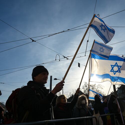 Participants gather hold up Israeli flags during a demonstration in Leipzig, Germany, Saturday, Jan. 17, 2026. (Heiko Rebsch/dpa via AP)