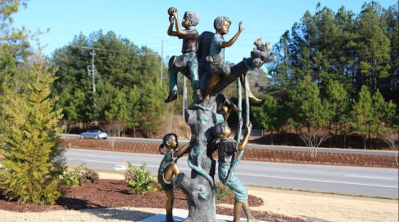 One of the many artworks Suwanee citizens can drive by to “I Arted In the Car” is “Five Kids in a Tree” by Ken Ross at Tomorrow’s Hope Montessori School, 305 Peachtree Industrial Blvd.