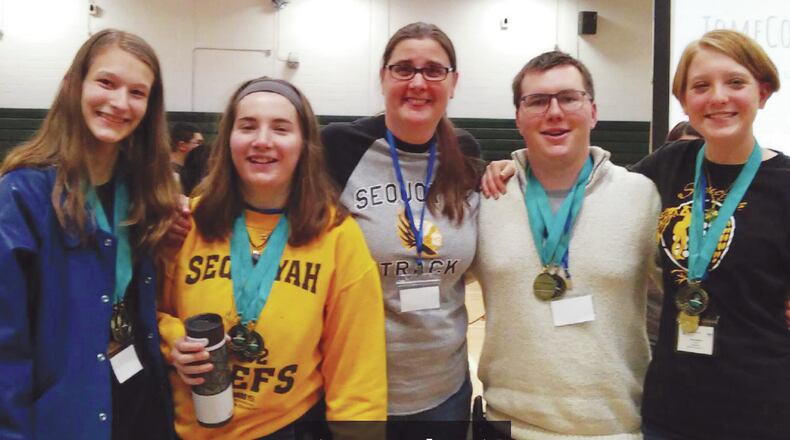 Celebrating their success are, from left: Abby George, Abbey Ford, chapter sponsor, media specialist Elease Franchini; Orion Harden and Brittany Wallace.