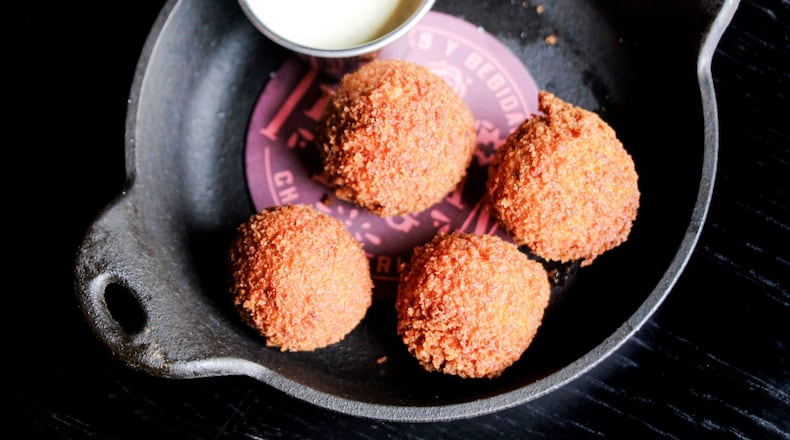 The Iberian Pig executive chef John Castellucci’s creamy and crisp turkey croquetas are a way to experience the comfort of a Thanksgiving meal the day after Thanksgiving. CONTRIBUTED BY EMILY BLACKWOOD