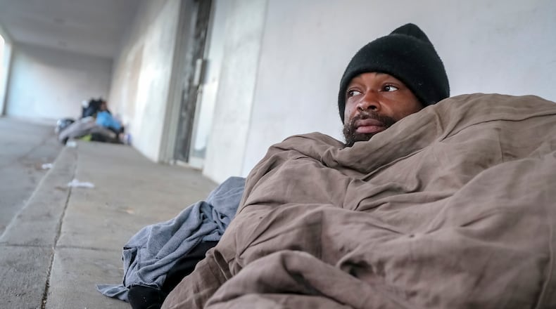 January 18, 2024 Atlanta: Antwan Slaton says the drop in temperatures into the teens makes a big difference, a major difference, when it comes to layering blankets and clothing while sleeping outside. Slaton spent the night on South Rhodes Center in Midtown with morning temperatures in the upper teens and lower 20s across the metro Atlanta area on Thursday, Jan. 18, 2024. Forecasters are warning that yet another shot of arctic air is on the way this weekend ahead of a January thaw next week. ((John Spink / John.Spink@ajc.com)