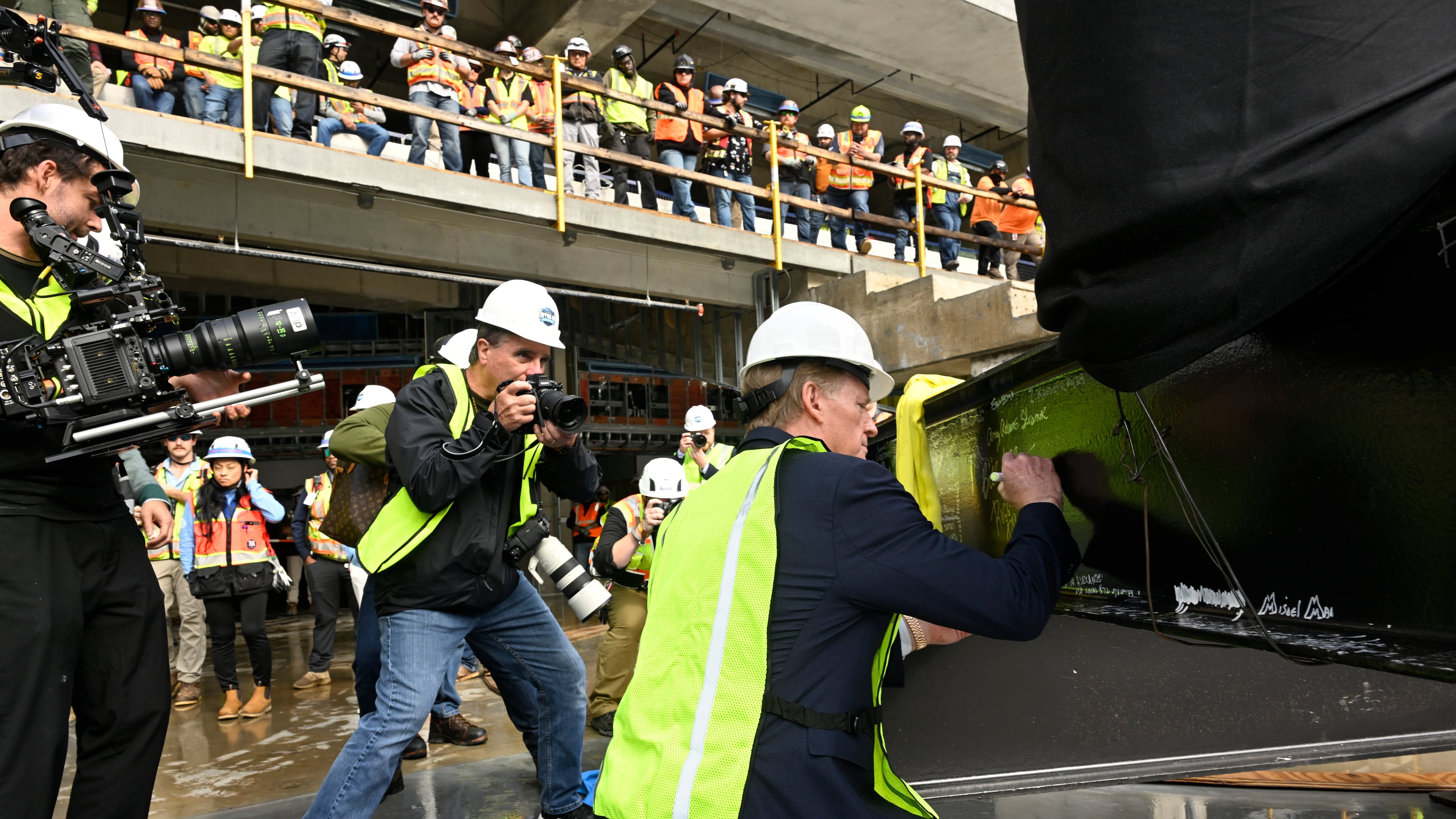 NFL Commissioner Roger Goodell signs a beam during a topping out ceremony to celebrate the ongoing construction of the Tennessee Titans NFL football new stadium, Friday, Nov. 21, 2025, in Nashville, Tenn. (AP Photo/John Amis)