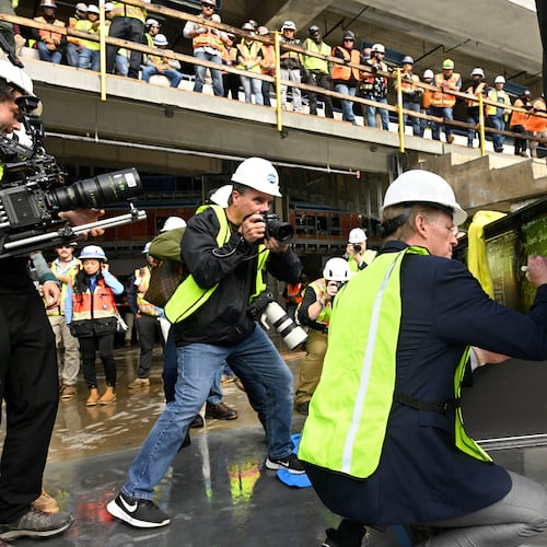 NFL Commissioner Roger Goodell signs a beam during a topping out ceremony to celebrate the ongoing construction of the Tennessee Titans NFL football new stadium, Friday, Nov. 21, 2025, in Nashville, Tenn. (AP Photo/John Amis)
