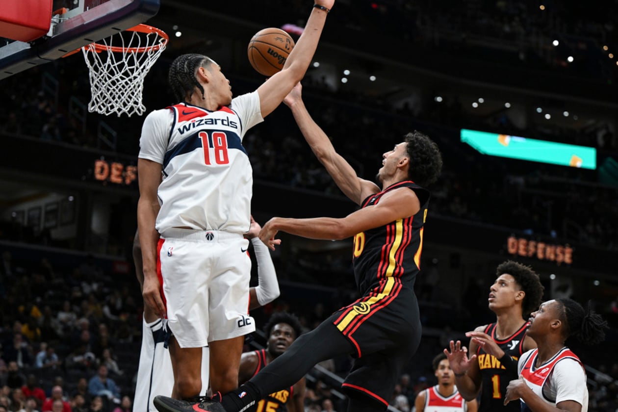 Atlanta Hawks forward Zaccharie Risacher (10) goes to the basket and attempts a lay-up against Washington Wizards forward Kyshawn George (18) during the second half of an NBA basketball game, Wednesday, Oct. 30, 2024, in Washington. (Terrance Williams/AP)