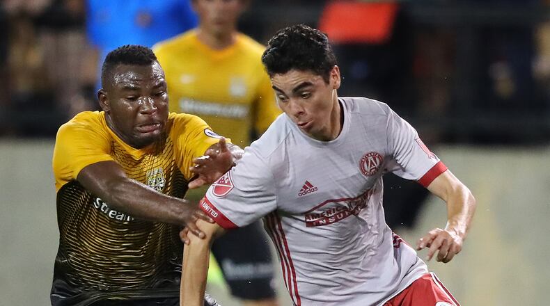 June 14, 2017, Kennesaw: Atlanta United midfielder Miguel Almiron battles Charleston Battery midfielder Tah Brian Anung in the Lamar Hunt U.S. Open Cup fourth round at 5th Third Bank Stadium on Wednesday, June 14, 2017, in Kennesaw. Curtis Compton/ccompton@ajc.com
