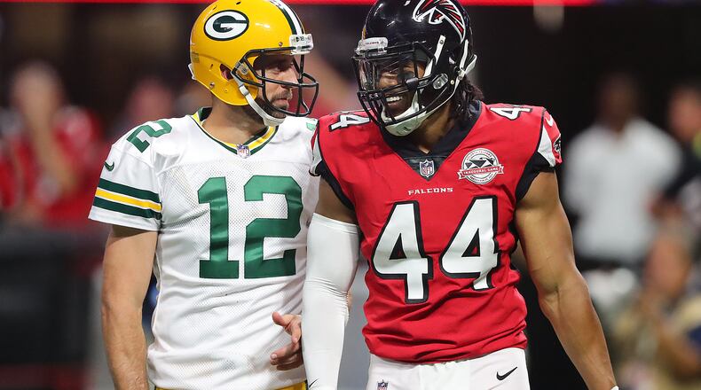 September 17, 2017 Atlanta: Falcons linebacker Vic Beasley Jr. shares words with Packers quarterback Aaron Rodgers after forcing a incomplete pass during the second quarter in a NFL football game on Sunday, September 17, 2017, in Atlanta.    Curtis Compton/ccompton@ajc.com