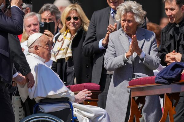 Pope Francis is cheered at by faithful at the end of a mass in St. Peter's Square at The Vatican, Sunday, April 6, 2025, part of the jubilee of the sick and the health workers. (AP Photo/Andrew Medichini)