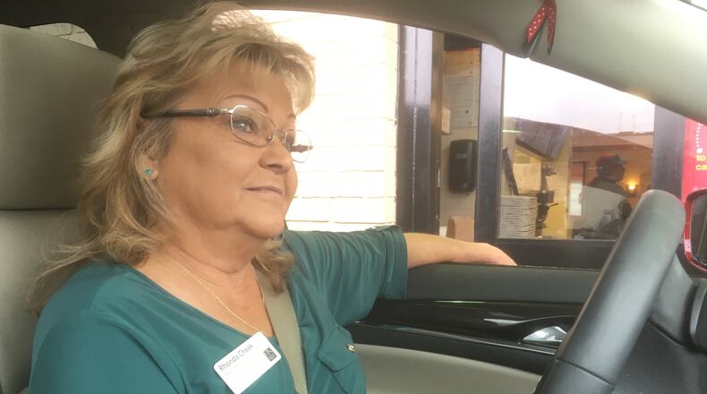 Rhonda Cheek awaits her usual breakfast order of oatmeal and a Coke in the drive-thru line. Photo: Jennifer Brett