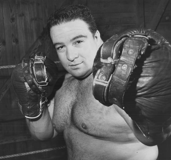 Paul Anderson shadow boxes with heavily weighted gloves. (Bill Wilson/AJC file photo) 1962