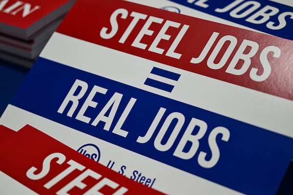 Signs are photographed before President Donald Trump speaks at United States Steel Corporation's Mon Valley Works-Irvin Plant, Friday, May 30, 2025, in West Mifflin, Pa. (AP Photo/David Dermer)