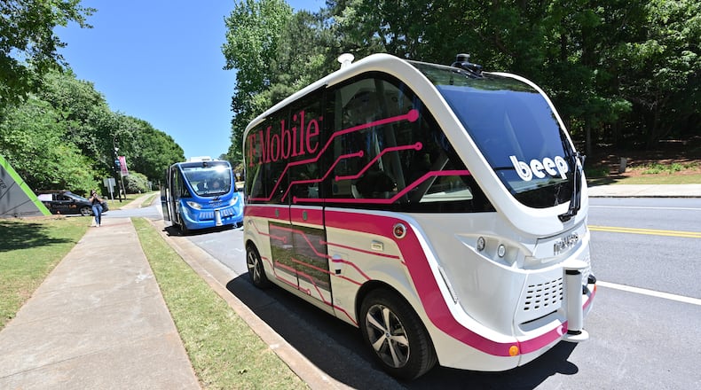 May 12, 2022 Peachtree Corners - Guests get a test ride of an autonomous shuttles in Peachtree Corners on Thursday, May 12, 2022. On Thursday May 12, top automakers, technology companies and carriers are coming together at the Curiosity Lab in Peachtree Corners and Applied Information in Alpharetta for live demos as part of the 5G Automotive Association (5GAA) conference. (Hyosub Shin / Hyosub.Shin@ajc.com)