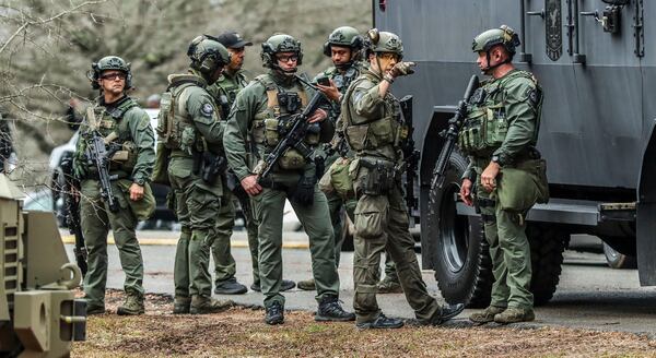 DeKalb and Atlanta SWAT members leaving from Gresham Park command post. Georgia state troopers helping conduct a "clearing operation" at the site of Atlanta's planned public safety training center exchanged gunfire with a protester on Jan. 18, 2023, leaving the protester dead and one trooper wounded, according to the Georgia Bureau of Investigation. (John Spink/The Atlanta Journal-Constitution/TNS)