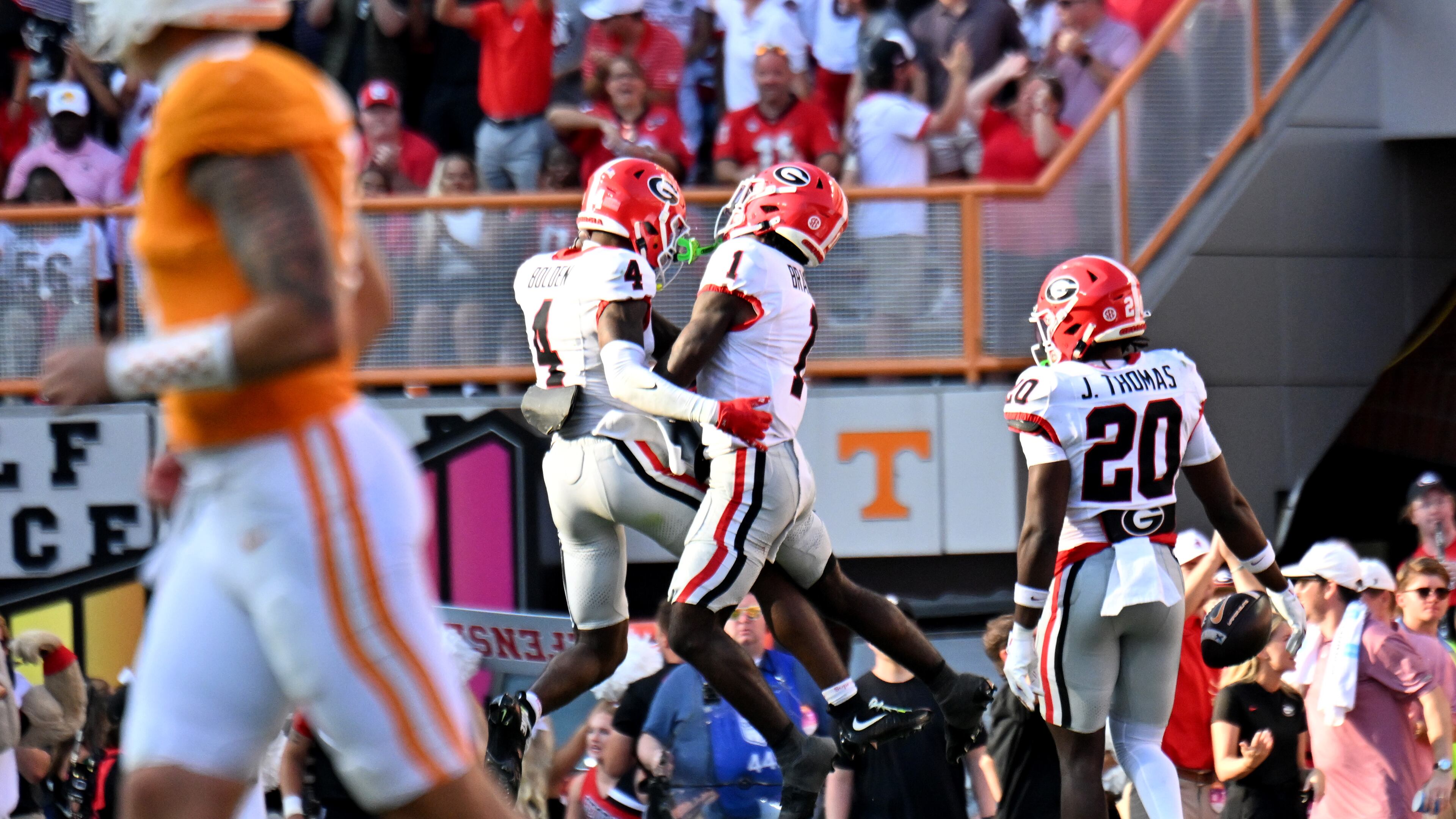Georgia defensive back KJ Bolden (left) celebrates after recovering a fumble during the second half in an NCAA football game at Neyland Stadium, Saturday, Sept. 13, 2025, in Knoxville, Tennessee. Georgia won 44-41 over Tennessee in overtime. (Hyosub Shin/AJC)