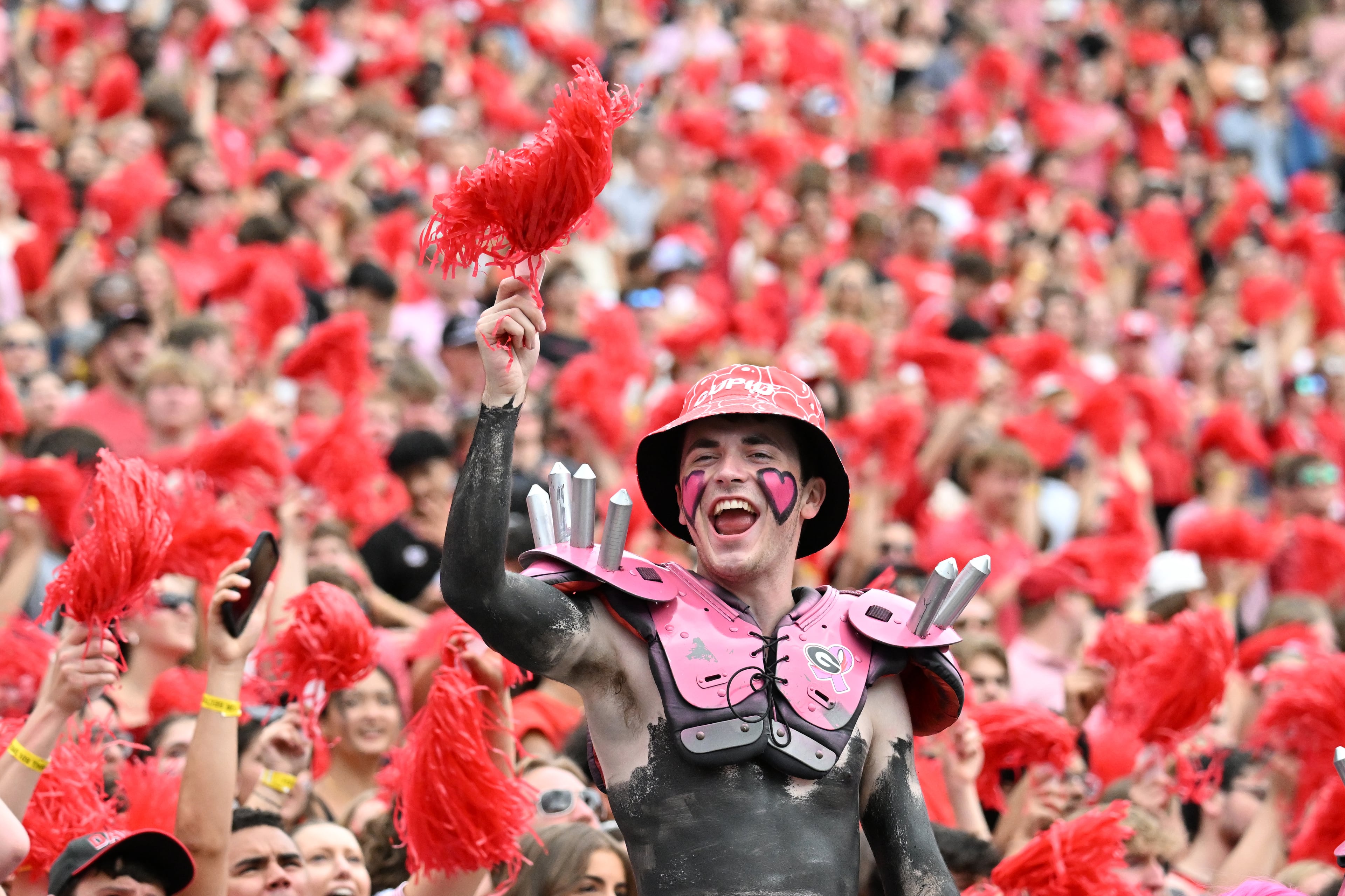 Georgia fans cheer during the second half in a NCAA college football game at Sanford Stadium, Saturday, October 4, 2025, in Athens. Georgia won 35 -14 over Kentucky. (Hyosub Shin / AJC)