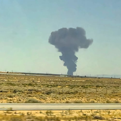 Smoke plumes rise from a B-52 bomber that crashed shortly after takeoff at a U.S. Air Force base in Southern California, Monday, June 15, 2026. (Debbie Reyes Katz via AP Photo)