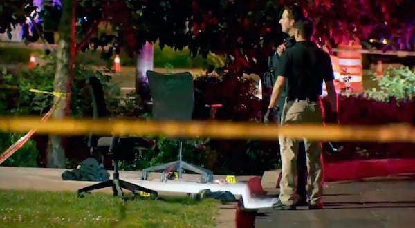 This image taken from video provided by KATU-TV shows police investigating a stabbing at a shelter in Salem, Ore., June 1, 2025. (KATU-TV via AP)