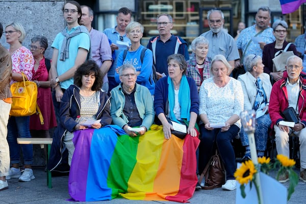 FILE - A public blessing ceremony with hundreds of believers takes place in front of the Cologne Cathedral in Cologne, Germany, on Sept. 20, 2023. (AP Photo/Martin Meissner, File)