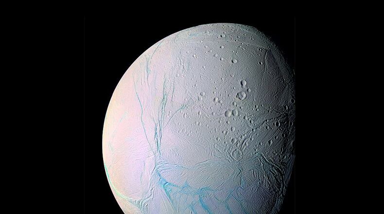This photo of Saturn’s moon Enceladus, taken by the Cassini spacecraft, shows the cracks in the icy surface. Cassini detected some of the chemical elements needed for life in plumes of gas and particles erupting from the moon’s surface.