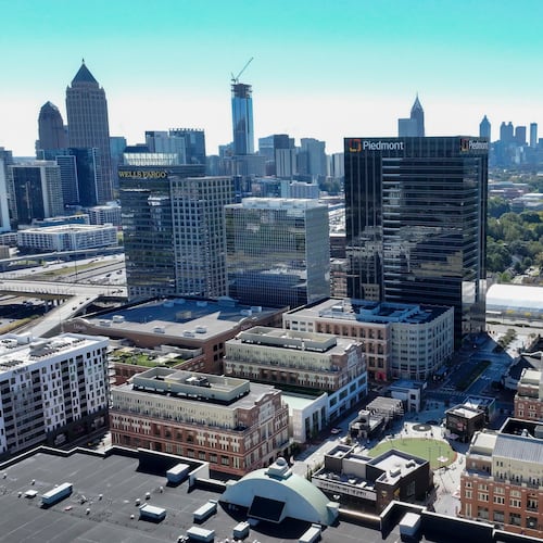 An aerial image shows the main square at Atlantic Station with the Atlanta skyline in the background on Thursday, Oct. 16, 2025. 
(Miguel Martinez/AJC)